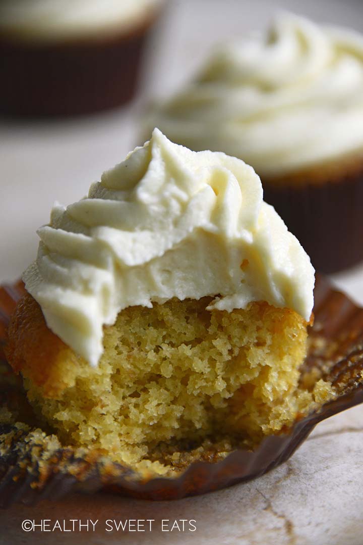 keto vanilla cupcake with keto vanilla buttercream frosting with bite