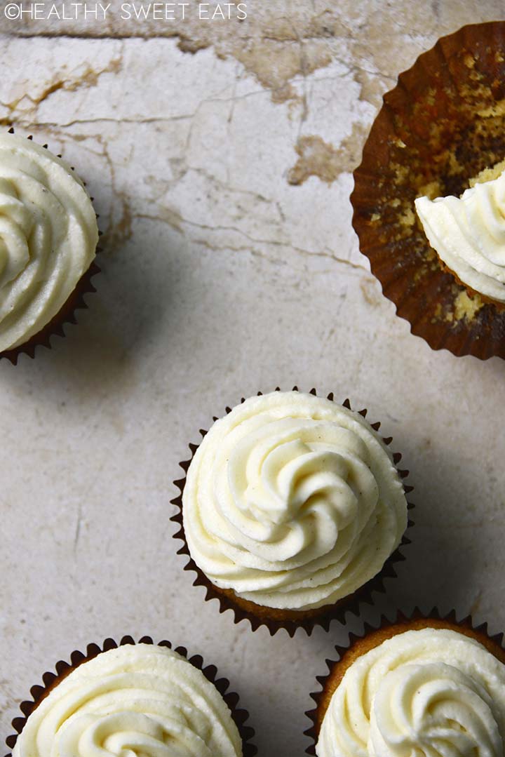 overhead view of swirled vanilla buttercream on keto vanilla cupcakes